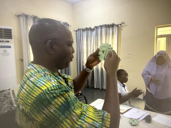 Dr. Adeniyi looking through the Foldscope eye-view